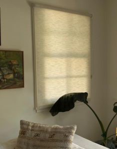 Expert installing custom window shades for bay window in Redwood City living room